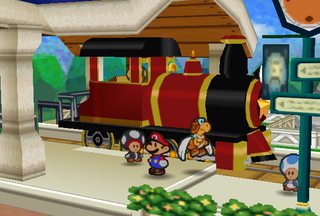 Mario and Parakarry standing by the K64.