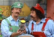 Luigi, holding a canister of Mario Brothers Plant Food.