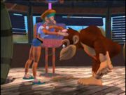 Donkey Kong Is about to get his hair cut by the Candy Robot.