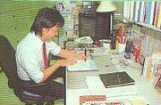 A game designer hard at work with Super Mario Bros. 3.