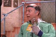 Dr. Toby holding a packet of his Super Plant Growth Formula.