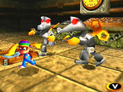 Tiny Kong being chased by two Toy Kritters.