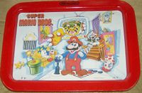 A Super Mario Bros. themed TV tray, featuring Mario, Luigi, two Mushroom Retainers, Bowser, a Goomba, and a framed portrait of Mario's dad.